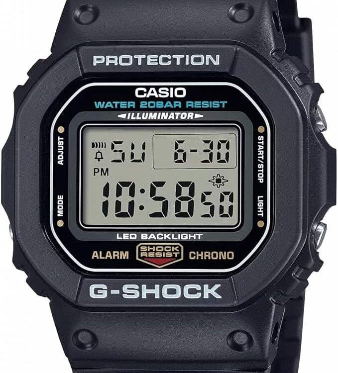 Casio G-Shock DW-5600UE-1 square digital watch, black resin case and strap, showing the grey LCD with LED BACKLIGHT printed below the display